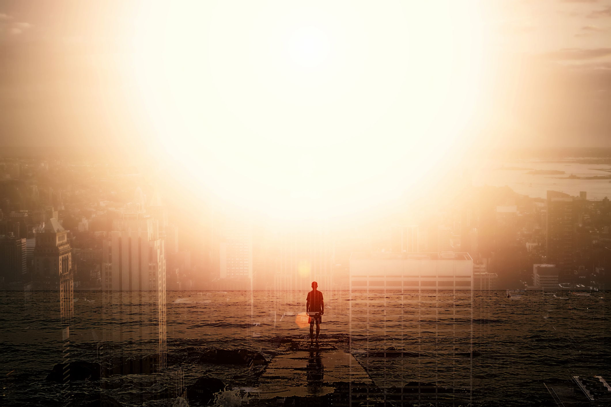 Person walking into sunset