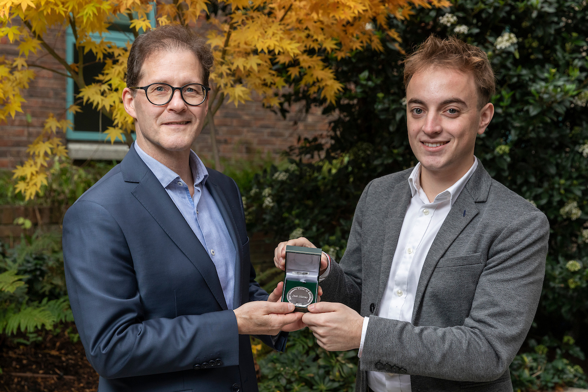 Daniel Carey pictured presenting medal to winner