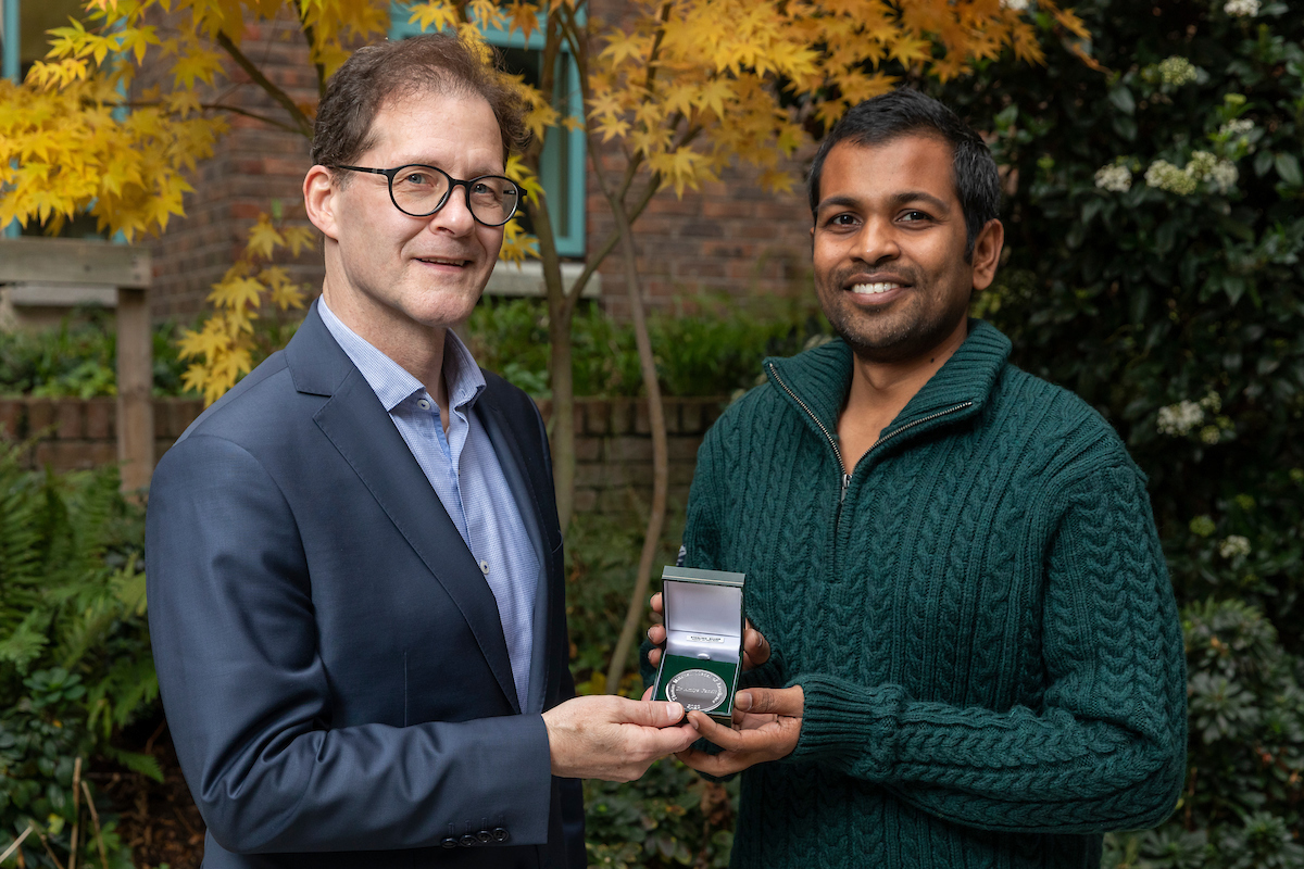 Daniel Carey pictured presenting medal to winner