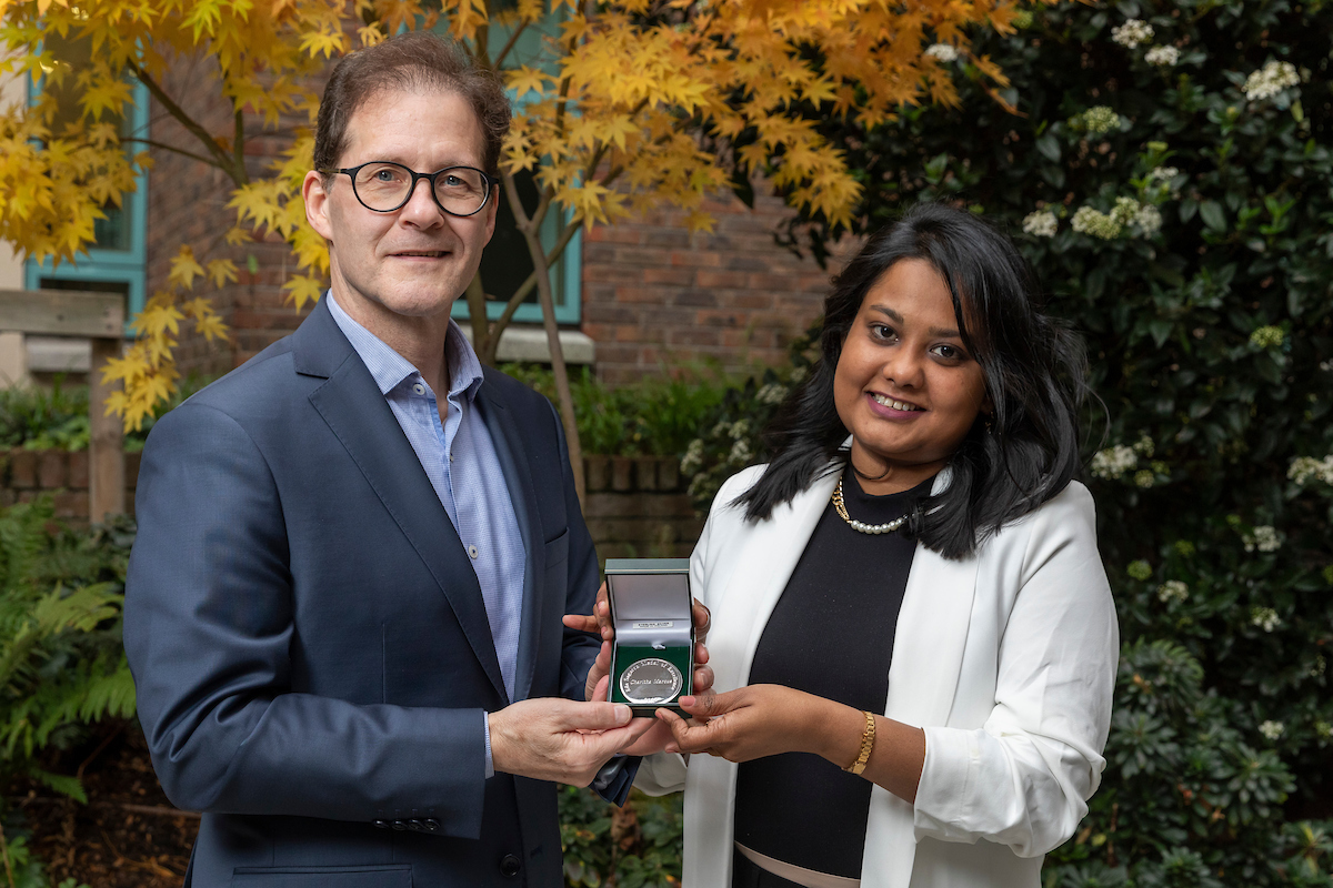 Daniel Carey presenting medal to winner