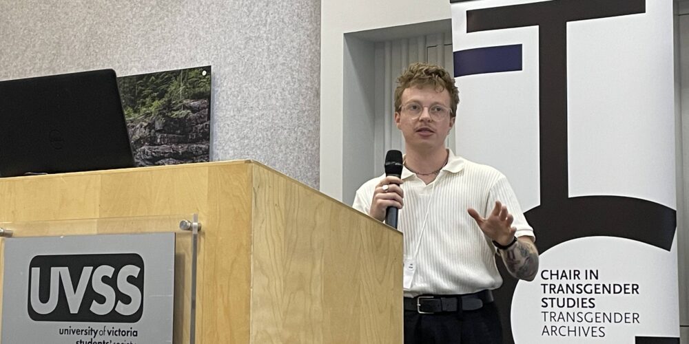Researcher Matt Kennedy, speaking from a podium in a public setting