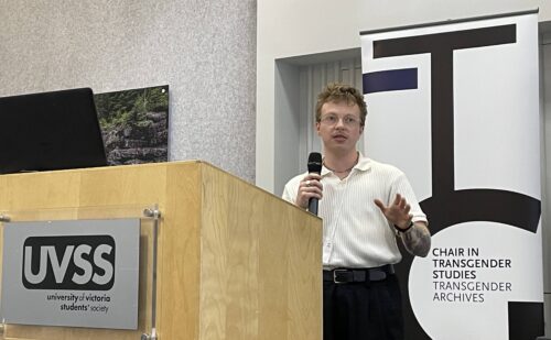 Researcher Matt Kennedy, speaking from a podium in a public setting