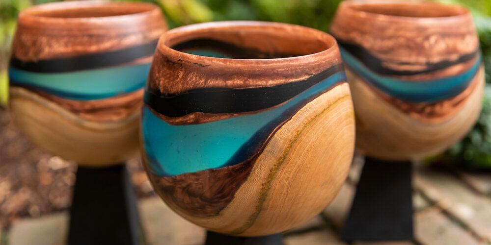 Three IRC Researcher of the Year Award trophies, designed by Kathleen Walsh