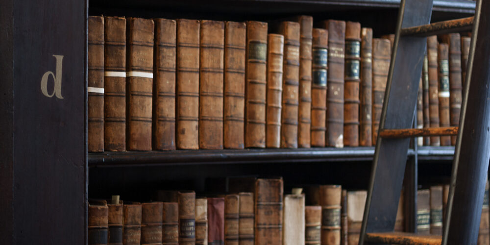Old books on a library shelf