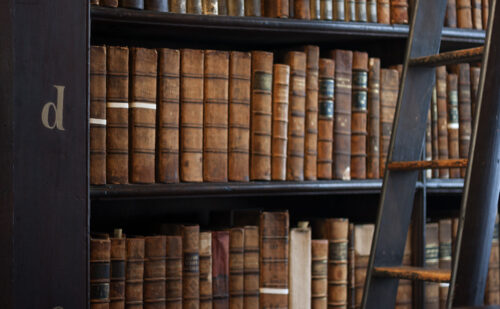 Old books on a library shelf