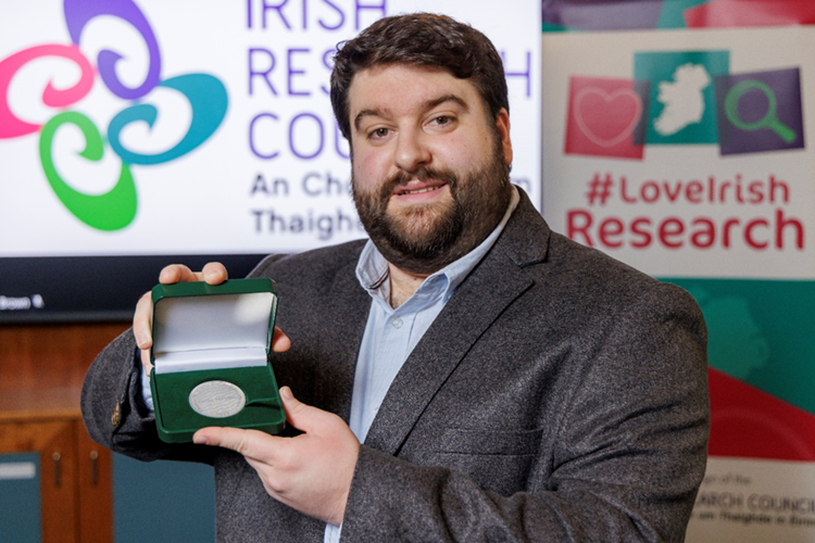 Carlos Matellan pictured holding a medal