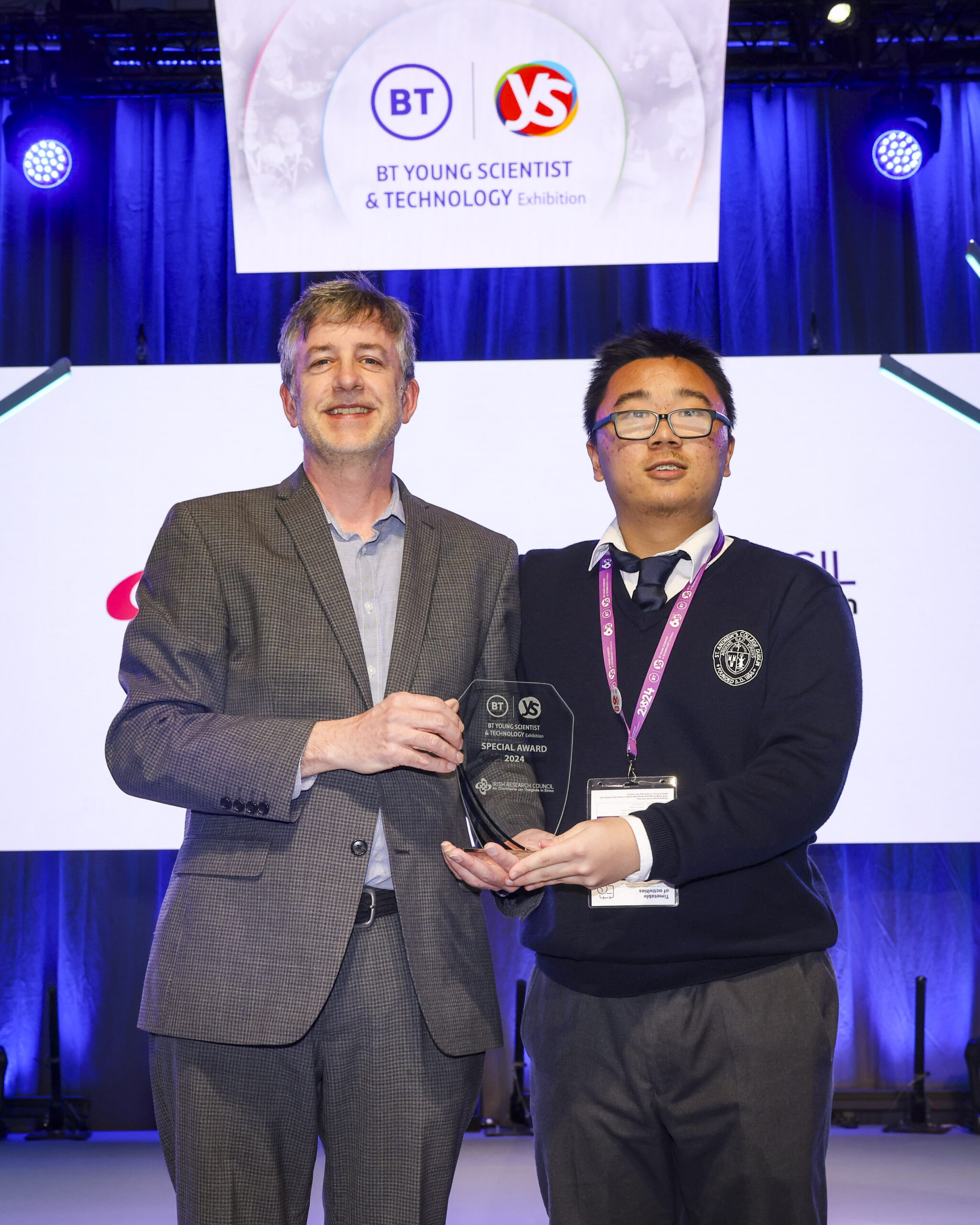 IRC Director Peter Brown awarding a trophy to BT Young Scientist IRC winner
