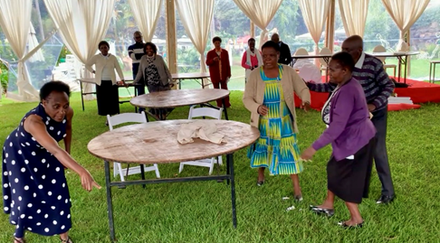 Photo of conference attendees sitting at tables and engaging