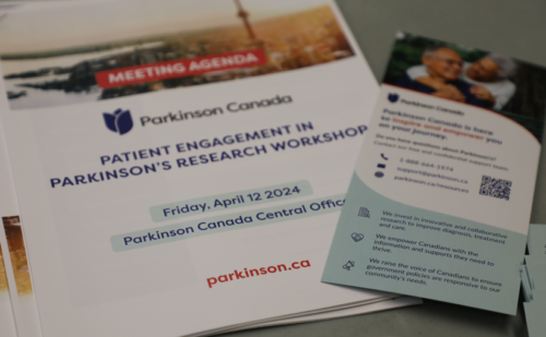 Image of brochure's for a conference. on Parkinson's Research workshop